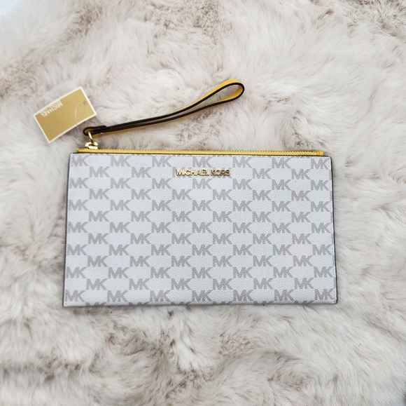 Michael Kors Handbags - Michael Kors NWT white‎ monogram print yellow accents authentic large wallet